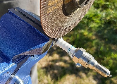 Angle grinder cutting of thread on plug